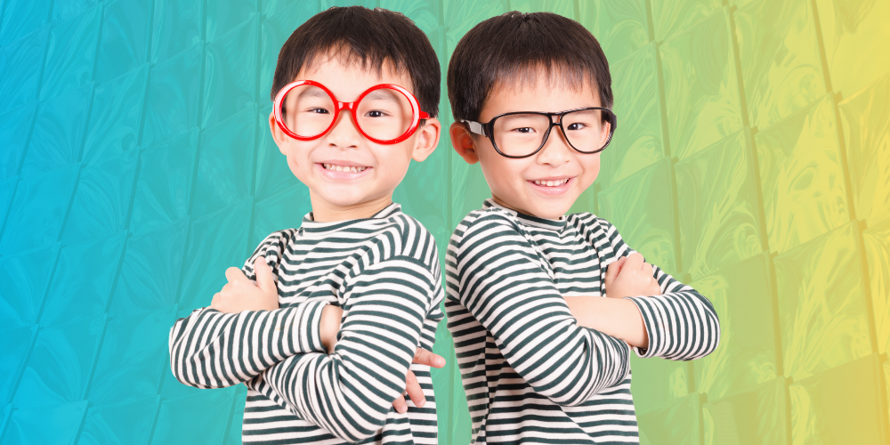Two twin boys wearing glasses, to represent the similarities between marketing and accounting.