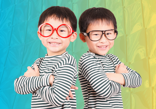 Two twin boys wearing glasses, to represent the similarities between marketing and accounting.