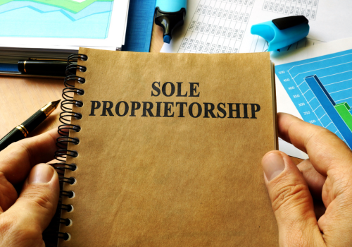 how to pay yourself image- brown notebook with title sole proprietor